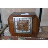 A WALNUT CASED WESTMINISTER CHIMING MANTLE CLOCK