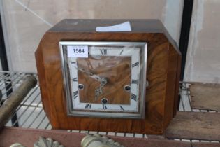 A WALNUT CASED WESTMINISTER CHIMING MANTLE CLOCK