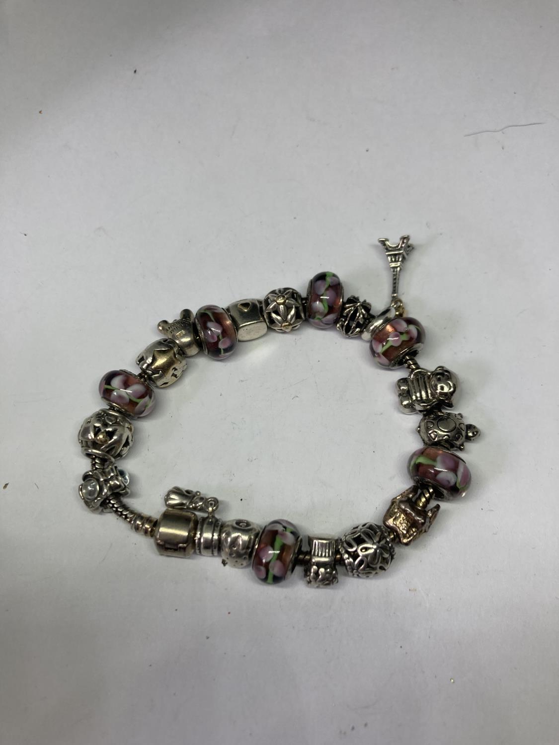 A SILVER PANDORA STYLE BRACELET