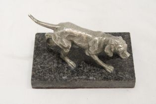 A WHITE METAL DOG ON A MARBLE STAND