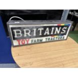 AN ILLUMINATED BRITAINS TOY FARM TRACTORS SIGN (L:68CM H:25CM)