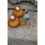 TWO GLASS OIL LAMPS WITH CLEAR AND ORANGE GLASS SHADES
