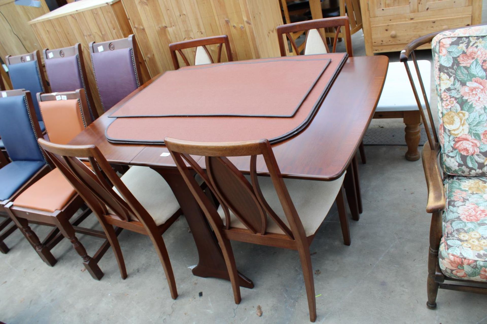 A MAHOGANY AND CROSSBANDED DROP-LEAF DINING TABLE AND FOUR CHAIRS