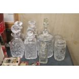 A MIXED LOT OF GLASSWARE TO INCLUDE SIX DECANTERS AND THREE JARS