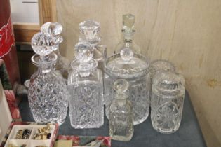 A MIXED LOT OF GLASSWARE TO INCLUDE SIX DECANTERS AND THREE JARS