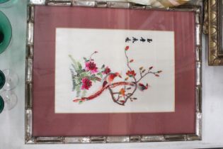 AN ORIENTAL SILK HAND EMBROIDERED ART PIECE IN A BAMBOO FRAME