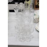 A MIXED LOT OF GLASSWARE TO INCLUDE A PAIR OF CANDLE STICKS, LARGE JUG, SHERRY GLASSES, BRANDY