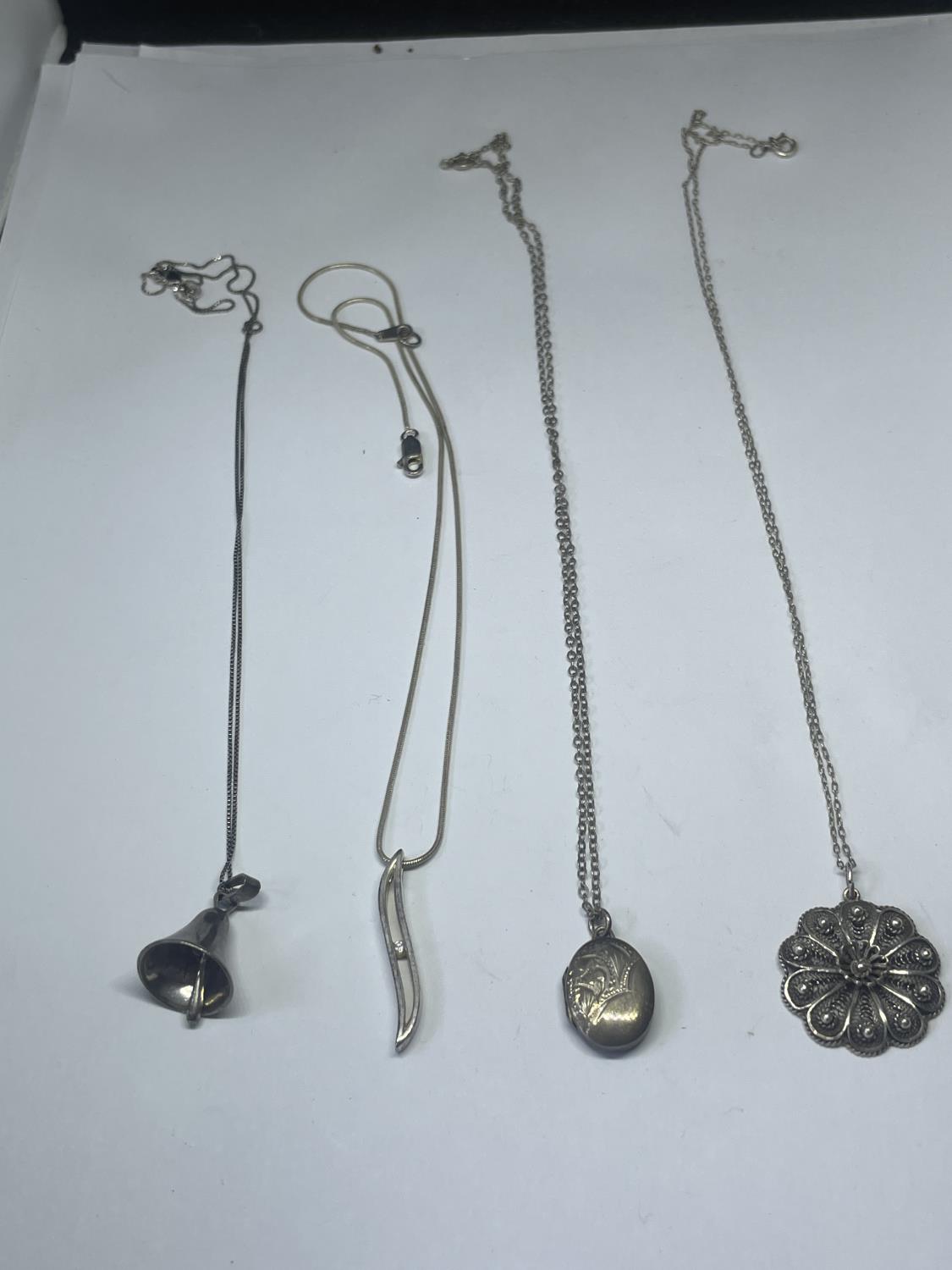 FOUR SILVER NECKLACES WITH PENDANTS