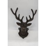 A CAST IRON WALL HANGING STAG - 11 X 9 INCH