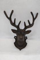 A CAST IRON WALL HANGING STAG - 11 X 9 INCH