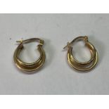 A PAIR OF 9 CARAT GOLD HOOP EARRINGS IN A THREE HOOP DESIGN