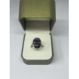 A SILVER RING WITH AN OVAL BLUE JOHN STONE IN A PRESENTATION BOX