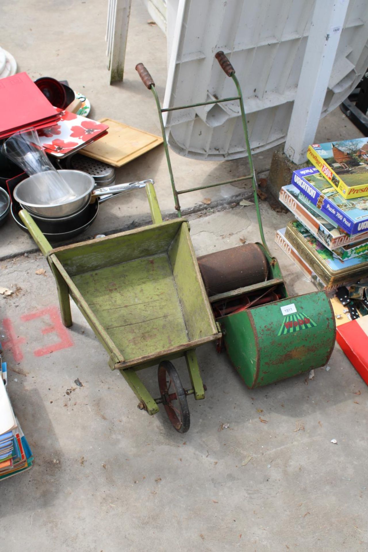A CHILDS WEBB PUSH MOWER AND A WOODEN WHEEL BARROW