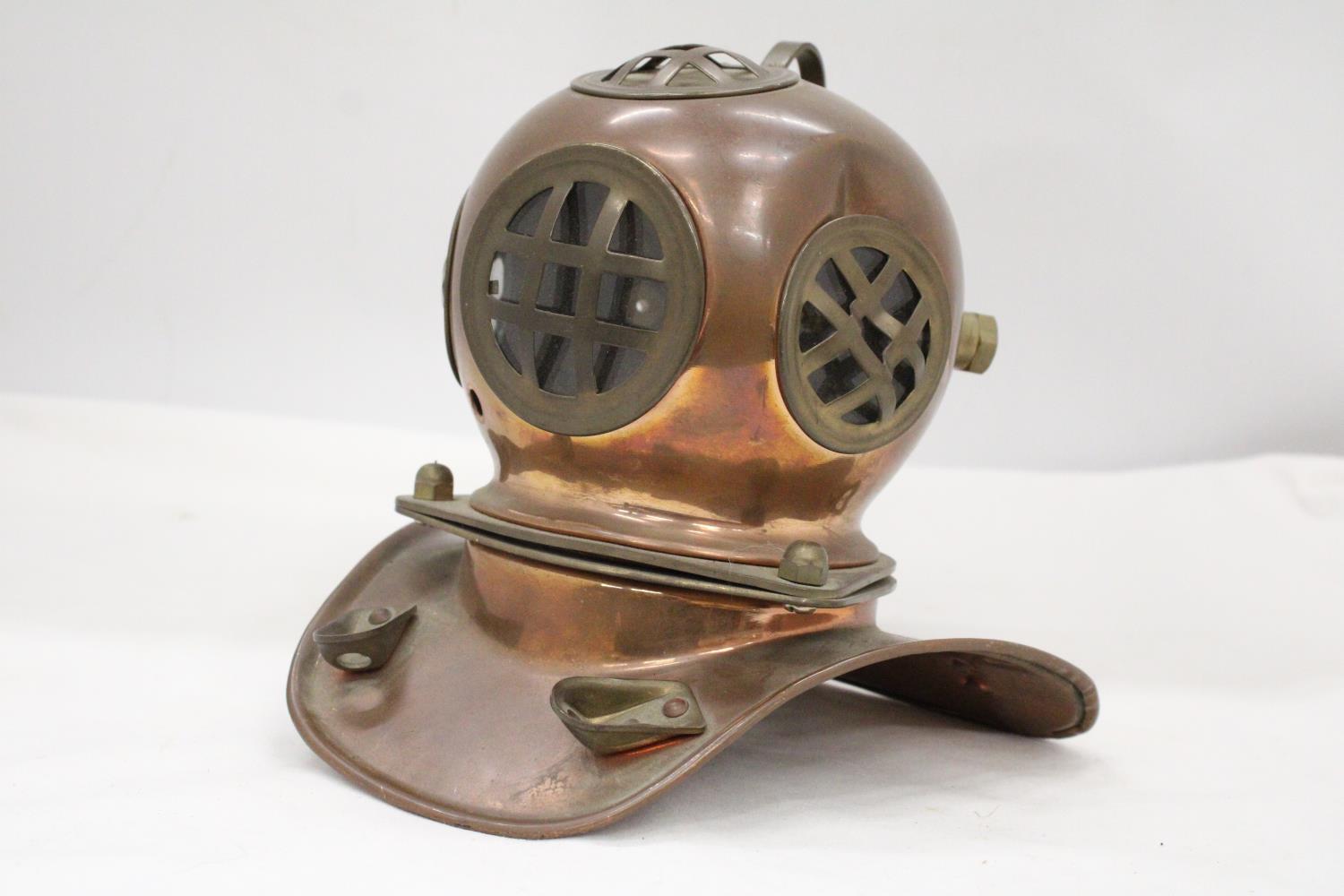 A VINTAGE COPPER AND BRASS DIVERS HELMET