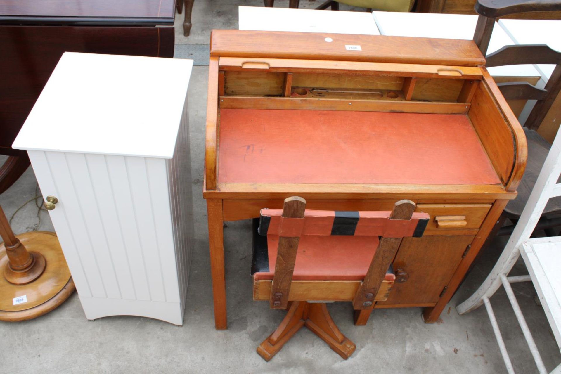 A MID 20TH CENTURY CHILDS ROLL-TOP DESK AND A SWIVEL CHAIR