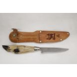 A DEER'S FOOT HUNTING KNIFE IN LEATHER SHEATH