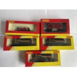 FIVE BOXED HORNBY 00 GAUGE FREIGHT CARRIAGES TO INCLUDE THREE SHELL TANKERS, A HORSE BOX AND A PLANK