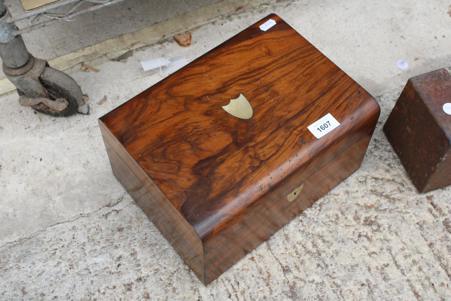 A VINTAGE WALNUT SEWING BOX WITH SILK INTERIOR AND INDIVIDUAL COMPARTMENTS
