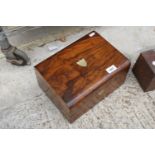 A VINTAGE WALNUT SEWING BOX WITH SILK INTERIOR AND INDIVIDUAL COMPARTMENTS