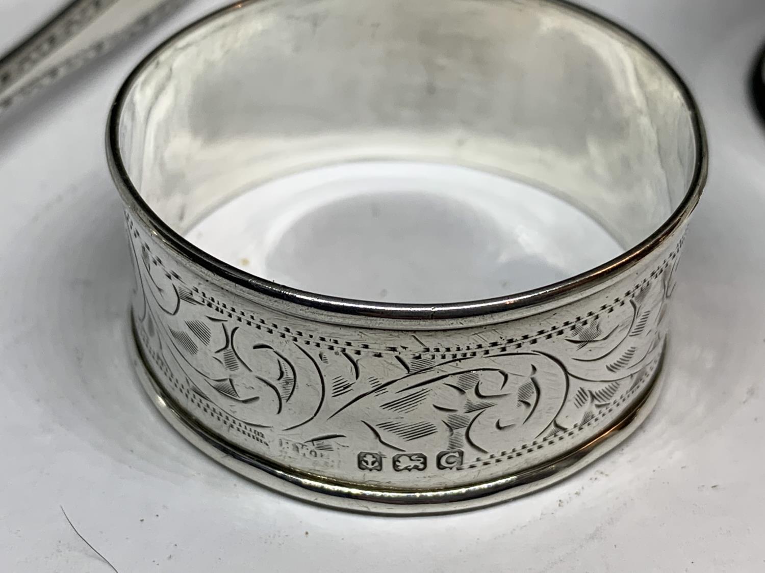 FOUR HALLMARKED SILVER ITEMS TO INCLUDE SHEFFIELD SUGAR NIPS AND THREE NAPKINS RINGS ONE BIRMINGHAM, - Image 3 of 7