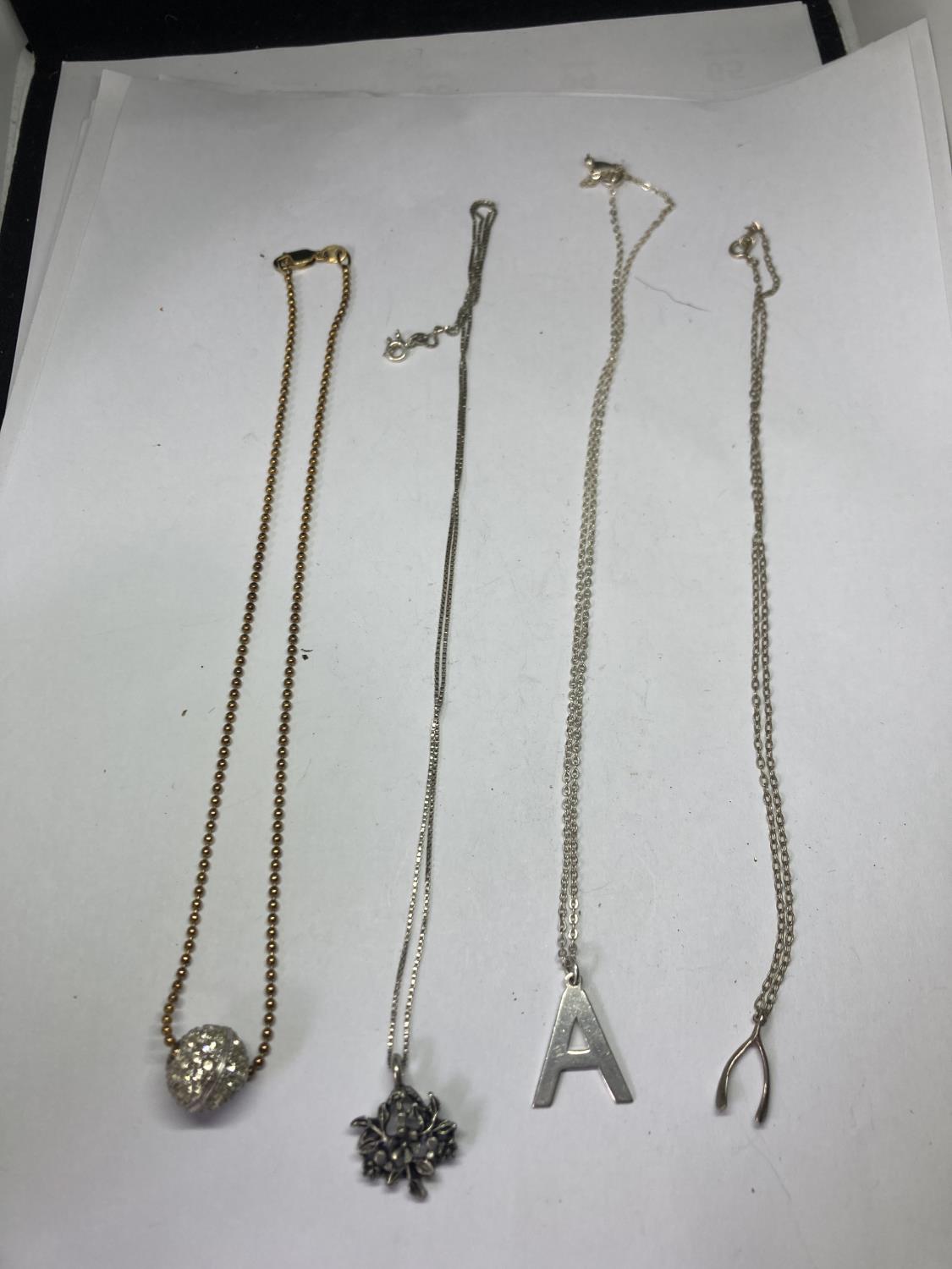 FOUR SILVER NECKLACES WITH PENDANTS