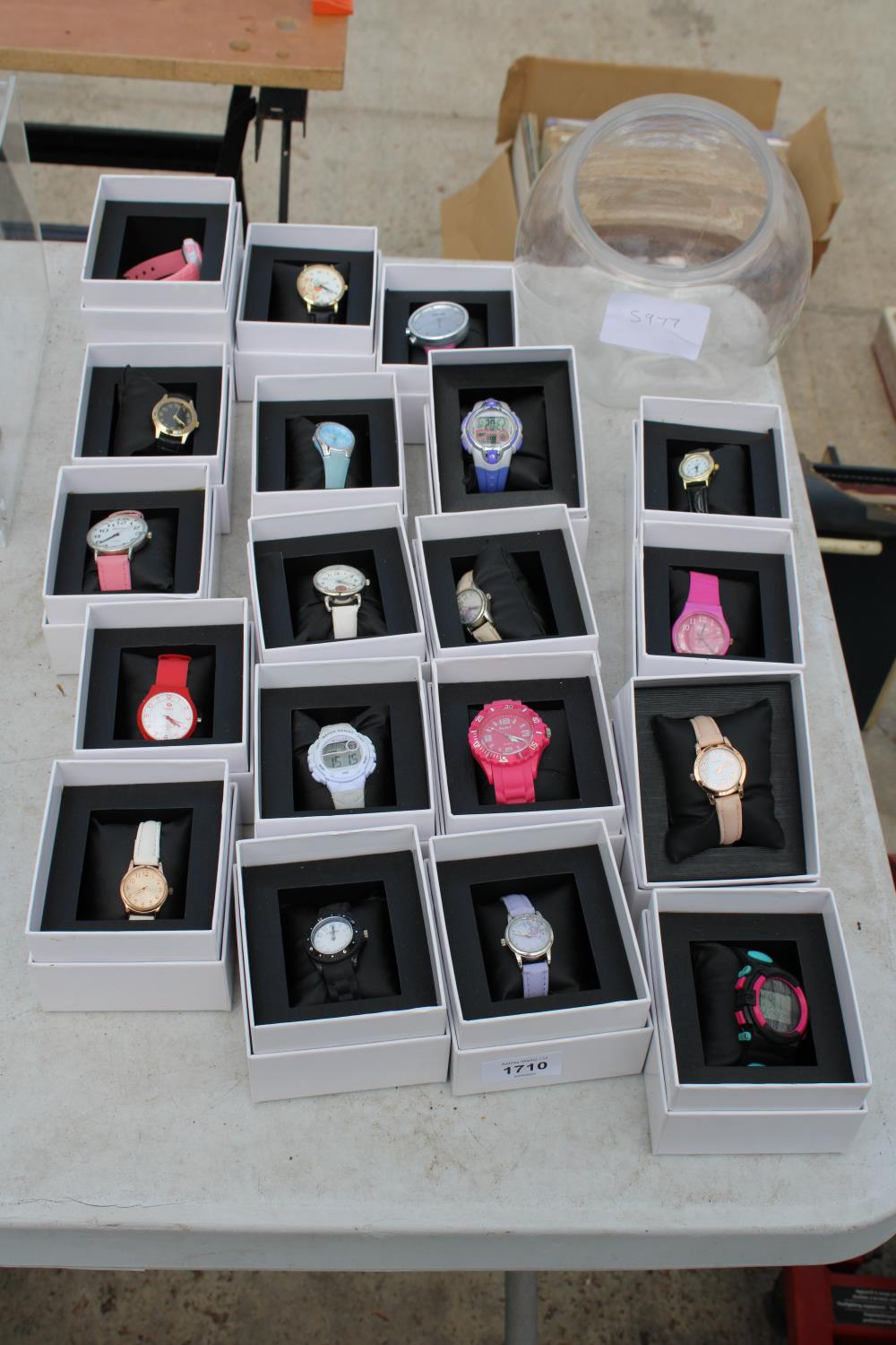 AN ASSORTMENT OF BOXED FASHION WATCHES