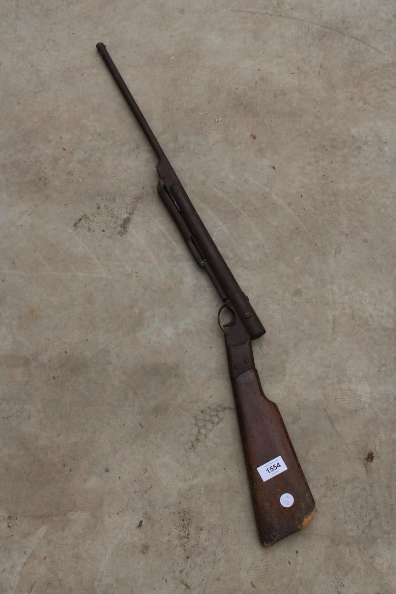 A VINTAGE WOODEN AND METAL AIR RIFLE