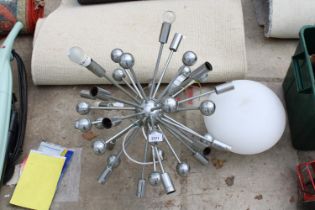 A STARBURST LIGHT FITTING AND A FURTHER LIGHT FITTING