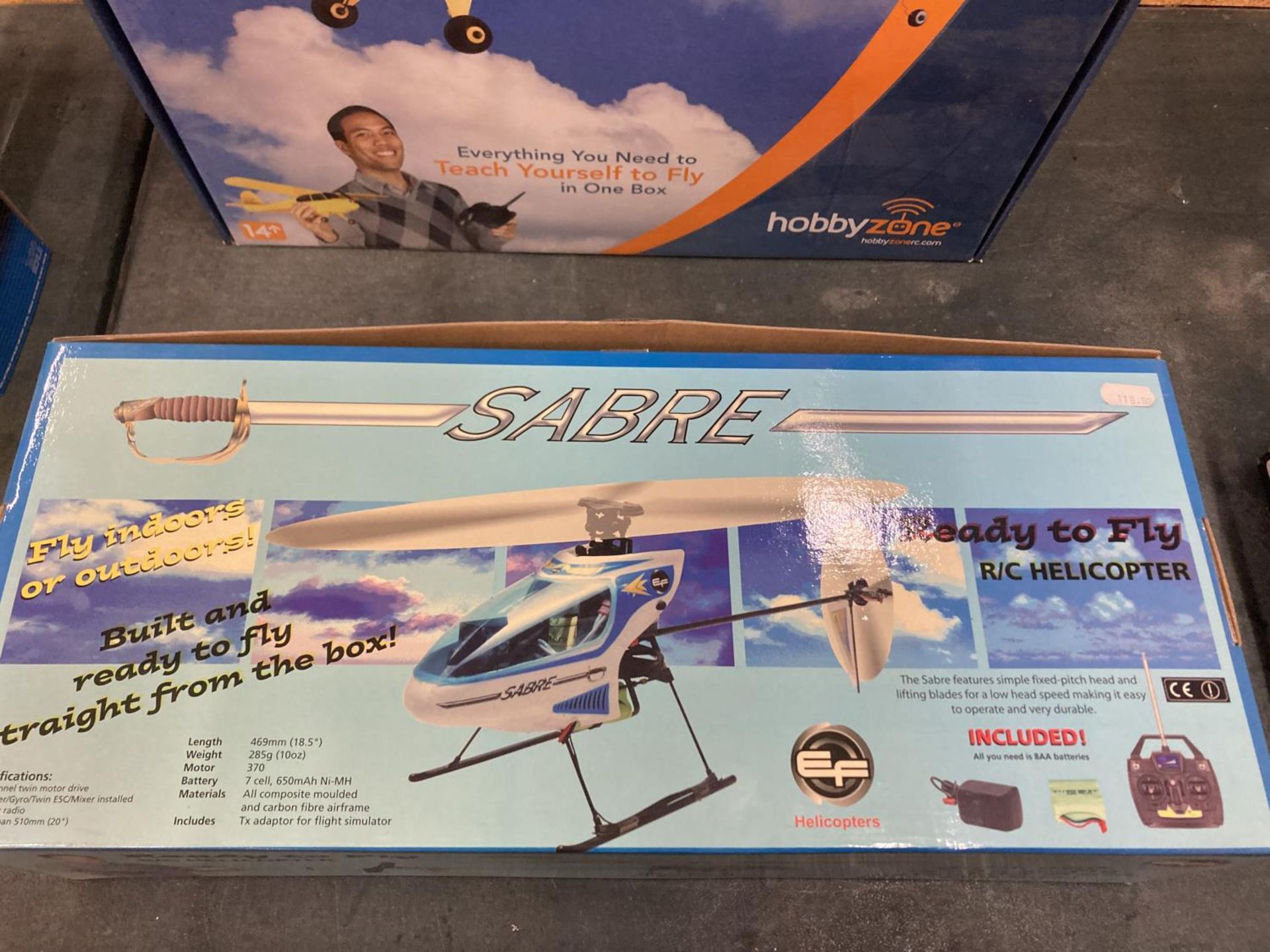 A BOXED SABRE READY TO FLY R/C HELICOPTER AND A HOBBYZONE R/C AREOPLANE, BOTH CONTROLLERS PRESENT - Image 2 of 7