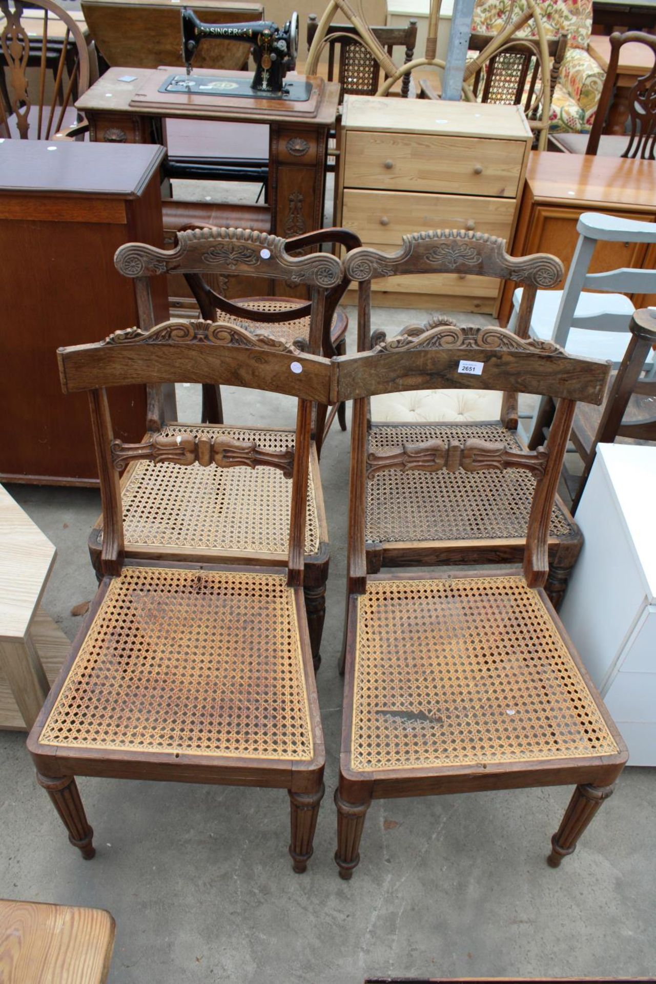 A SET OF FOUR ROSEWOOD WILLIAM IV DINING CHAIRS WITH CANE SEATS