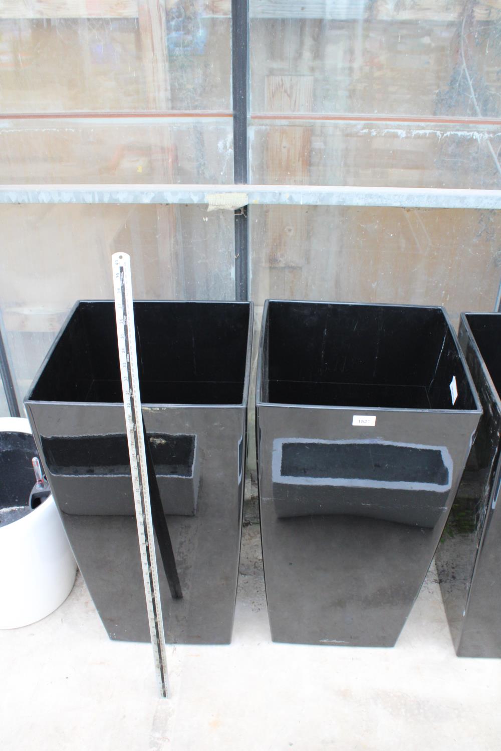 A PAIR OF TALL BLACK PLASTIC SQUARE PLANTERS (H:76CM W:40CM)