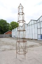 A GRADUATED HEXAGON TALL GARDEN OBELISK (H:217CM)