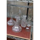 FIVE VARIOUS GLASS DECANTERS AND TWO COLLAR LABELS