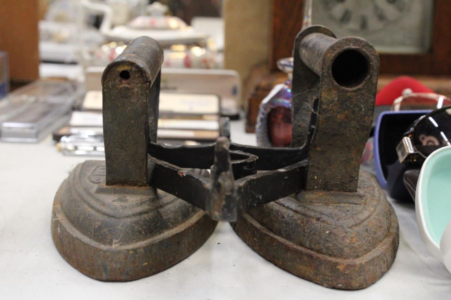 TWO VICTORIAN FLAT IRONS AND AN IRON TRIVET - Image 4 of 5