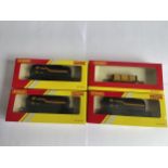 FOUR BOXED HORNBY 00 GAUGE FREIGHT CARRIAGES TO INCLUDE THREE SHELL TANKERS AND A PLANK WAGON