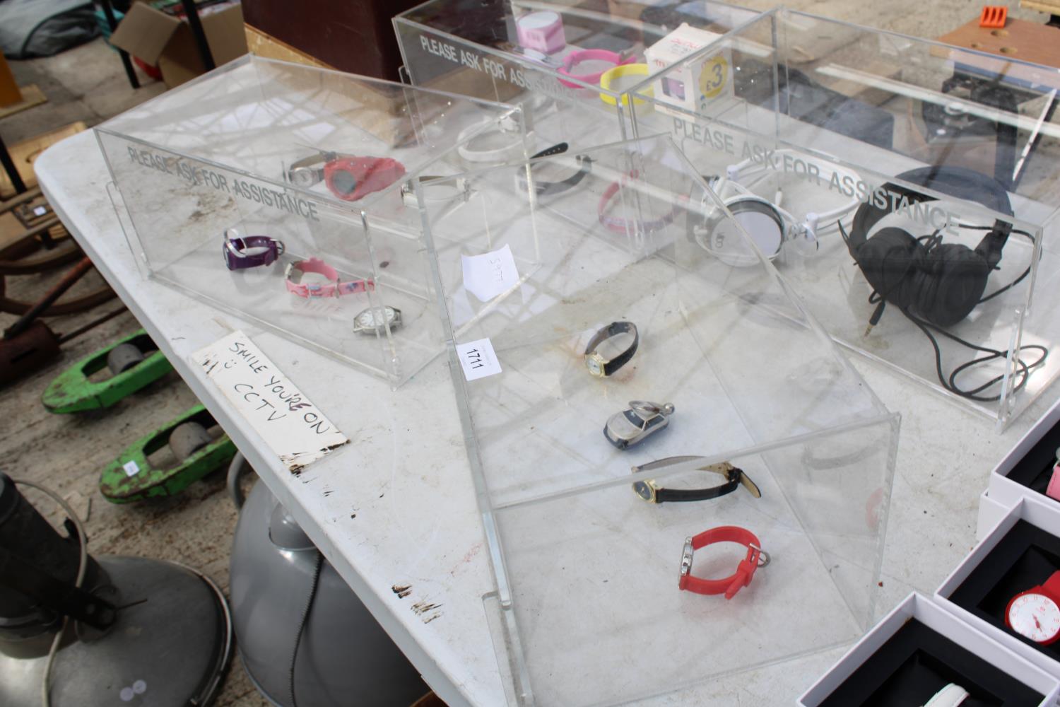 FOUR PLASTIC DISPLAY STANDS WITH AN ASSORTMENT OF FASHION WATCHES AND HEADPHONES - Bild 2 aus 3