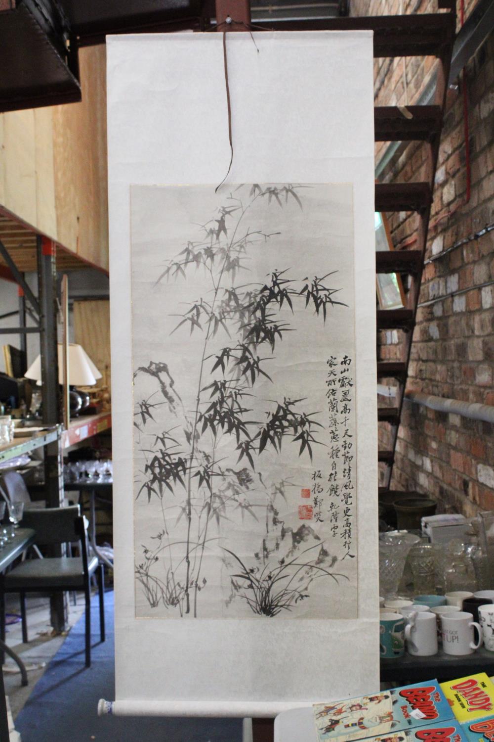 AN ORIENTAL SCROLL WITH BAMBOO DESIGN AND CHARACTER MARKS, ON PAPER BACKED MATERIAL, 60CM X 155CM