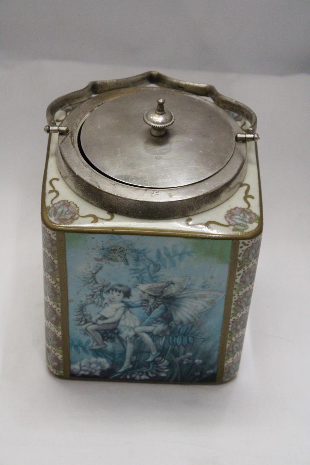 A CERAMIC BISCUIT BARREL DEPICTING FLOWER FAIRIES BY CICELY MARY BARKER - 12 x 6 x 6 INCH