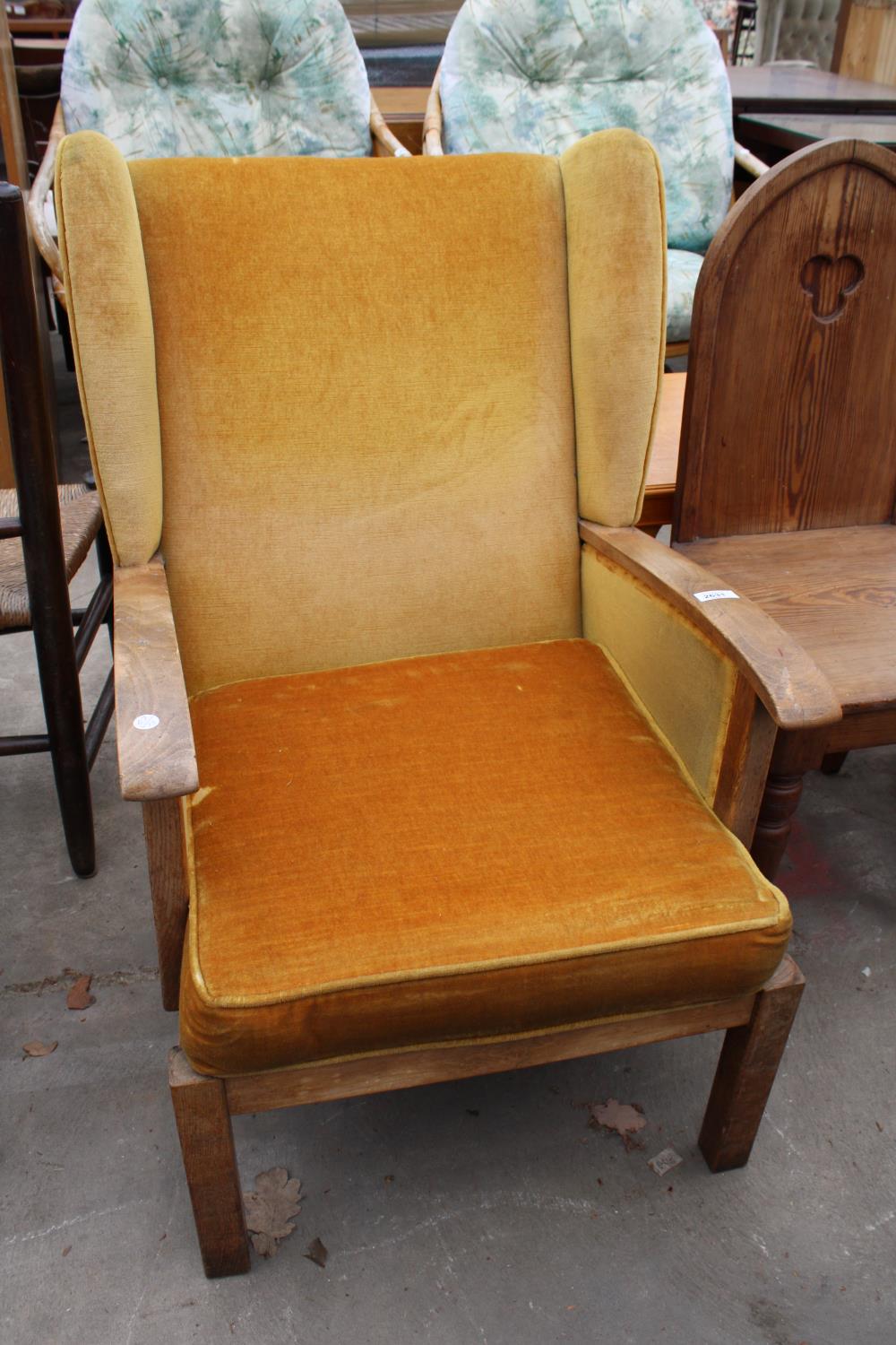 AN ART DECO STYLE WINGED FIRESIDE CHAIR, BEARING BE-AT-LES FURNITURE LABEL, BRISTOW AND TOWNSEND,