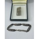 A SILVER MACINTOSCH BRACELET AND BROOCH IN A PRESENTATION BOX