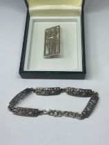 A SILVER MACINTOSCH BRACELET AND BROOCH IN A PRESENTATION BOX