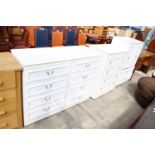 A MODERN WHITE TALLBOY AND TWO MATCHING CHESTS AND AN IGOE CHEST