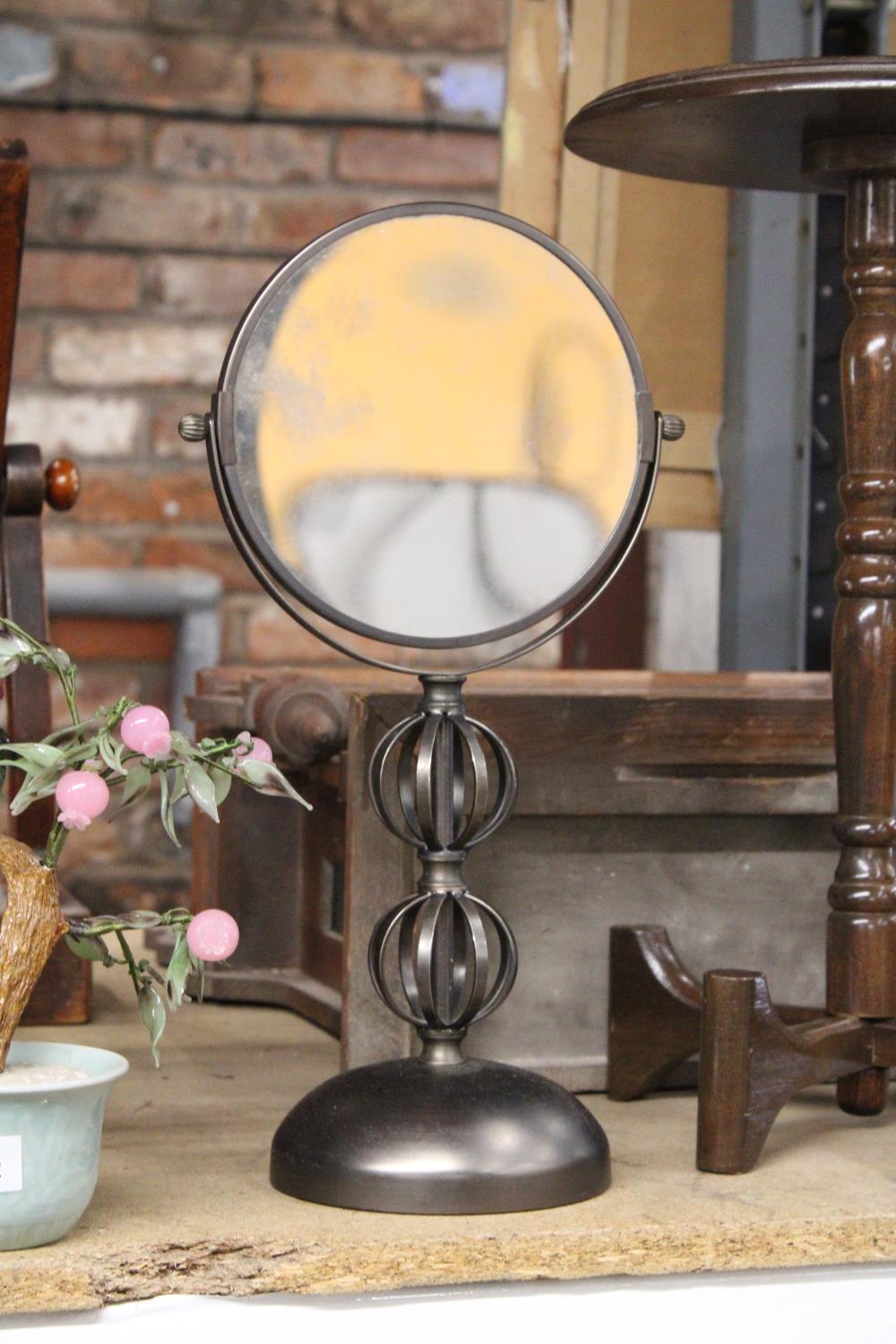 A MODERN COPPER COLOURED BATHROOM MIRROR, MAGNIFIED ON ONE SIDE, HEIGHT 42CM