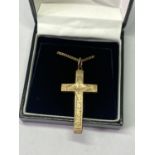 A GOLD PLATED CROSS AND CHAIN IN A PRESENTATION BOX