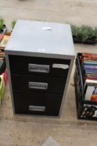 A METAL THREE DRAWER FILING CABINET