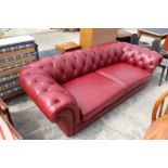 A MODERN RED LEATHER TWO / THREE SEATER CHESTERFIELD STYLE SETTEE