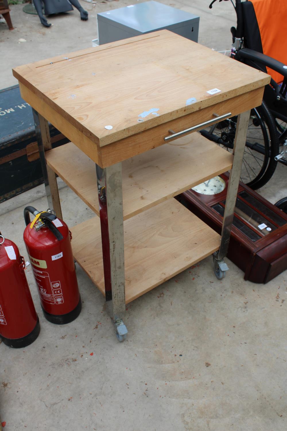 A FOUR WHEELED KITCHEN ISLAND BUTCHERS BLOCK