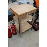 A FOUR WHEELED KITCHEN ISLAND BUTCHERS BLOCK