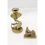 A VINTAGE BRASS GRYPHON CANDLESTICK PLUS A MOLLY MALONE FIGURE