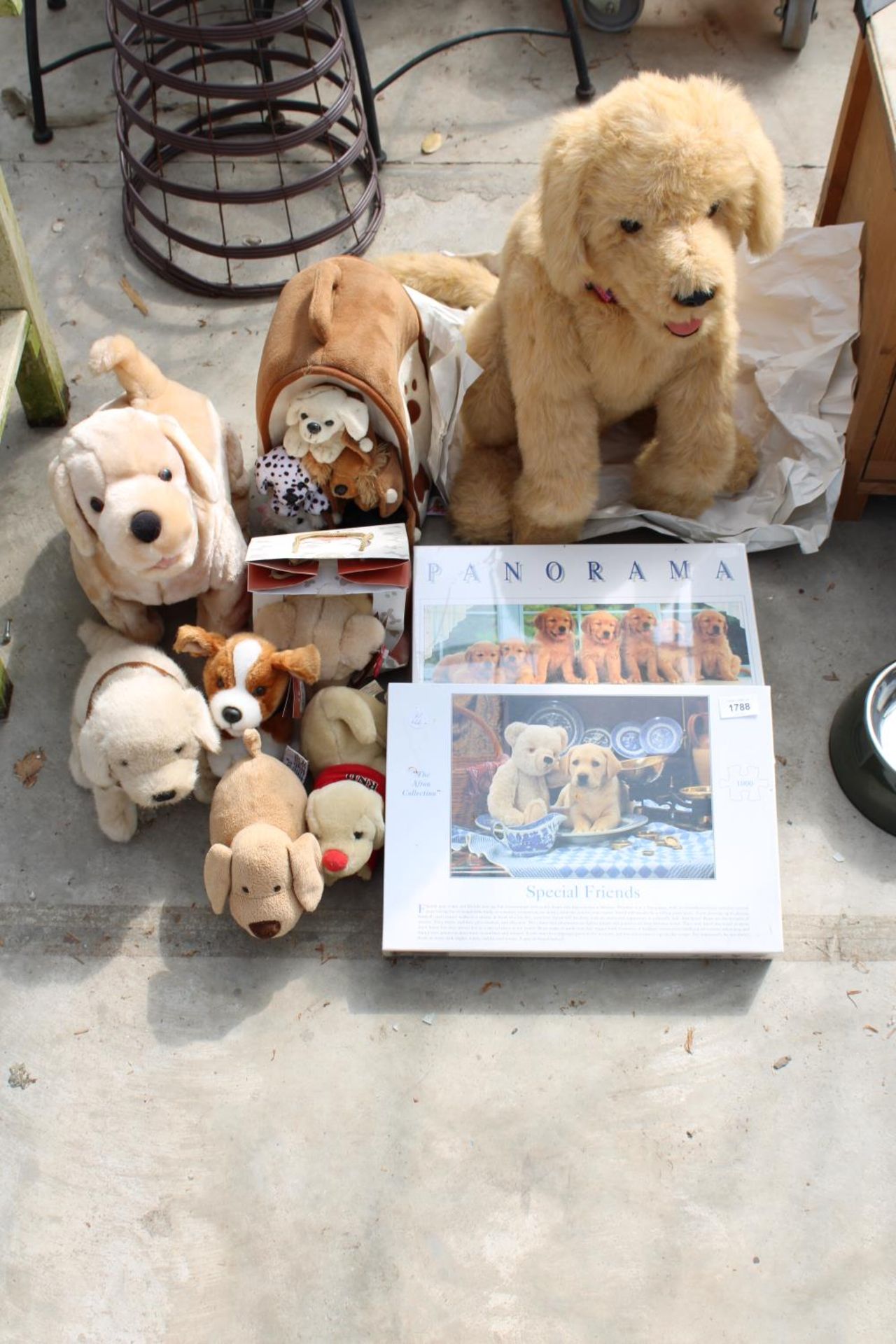 AN ASSORTMENT OF DOG RELATED CUDDLY TOYS AND TWO AS NEW AND UNOPENED JIGSAW PUZZLES